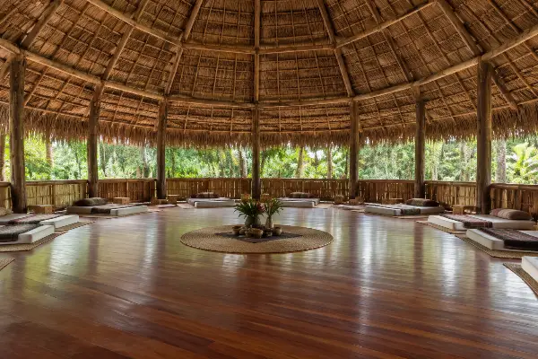 Empty ceremonial maloca at an Iquitos ayahuasca retreat in daylight